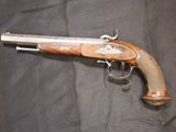 a gun that is on display on a black cloth