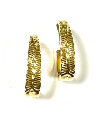 pair of gold toned hoop earrings on a white background