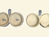 three bowls and a spoon sitting next to each other