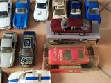 a lot of toy cars that are sitting on the floor