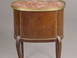 a side table with a marble top and wooden legs