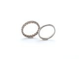 pair of silver rings on white background with copy space for text