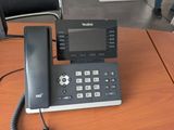 a telephone that is sitting on a table in a room