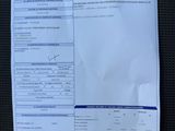 a close up of a receipt on a car seat