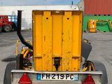 a yellow truck with a yellow trailer attached to it ' s back