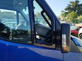 a blue truck that is parked in a parking lot