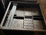 a drawer that has a bunch of boxes in it