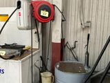 a picture of a gas station with a gas can and a gas pump