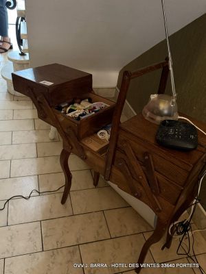 a desk with a laptop on it and a lamp on it