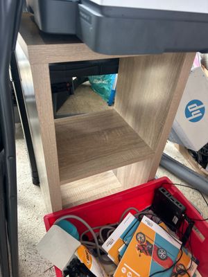 a red box filled with electronic equipment on the floor