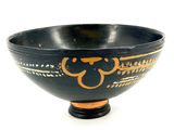 a black and gold bowl with a monkey on it