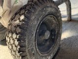 a close up view of a wheel on a dirt bike