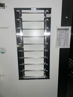 a picture of a wall mounted rack in a kitchen