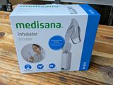 the box of the medisana inhaler is sitting on a wooden table