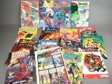 a lot of comic books sitting on a table