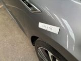 a close up of a car with a sticker on it
