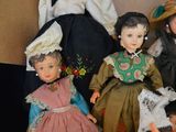 a lot of dolls that are sitting in a box