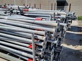 a lot of pipes that are stacked up in a lot