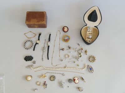a lot of jewelry sitting on a white table