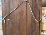 a wooden box with a rope on top of it