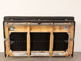 a bench made out of wood and black fabric
