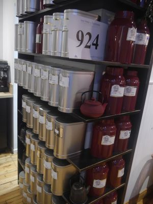 a shelf with a lot of containers and containers on it