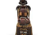 une image représentant une statue d'un samouraï assis sur un tabouret