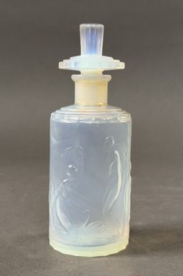 a small glass bottle with a clear top