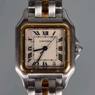an image of a close up of a wrist watch with roman numerals