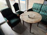 two chairs and a table in the corner of a room