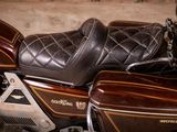 a close up of a motorcycle parked in a garage