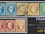 a group of four different colored stamps on a black background