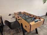 a foosball table in the corner of a room