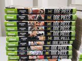 a lot of dvds stacked on top of each other