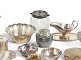 a lot of silver items that are on the table
