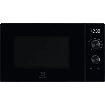 the black microwave oven has a digital clock on the front of it