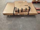 a box on a carton on the floor next to a pallet