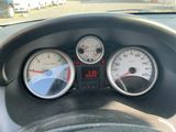 three gauges on the dashboard of a car