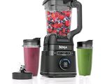an image of a blender with fruit and berries in it