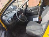 a small yellow car with a steering wheel and a black seat