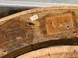 a close up of a piece of wood with a label on it