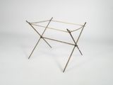 an image of a brass clothes rack on a white background