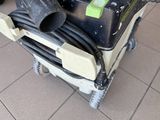 a black suitcase with a black handle on a cart