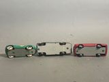 three miniature cars sitting side by side on a table