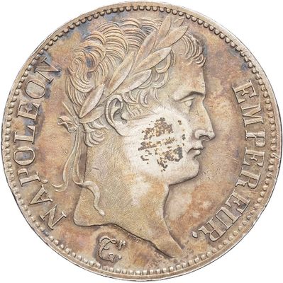 an old coin with a woman ' s face and a feather on it