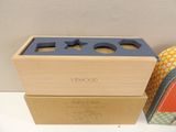 a wooden box with a blue lid sitting on a table