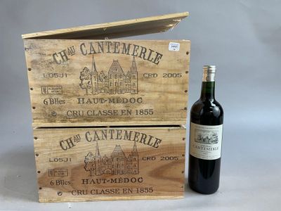 une bouteille de vin posée à côté d'une caisse en bois
