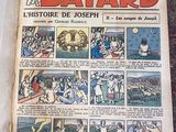 an old comic book is open on a table