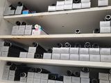 a shelf with many different types of cameras on it