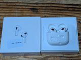 an apple airpods are sitting in a box on a wooden table